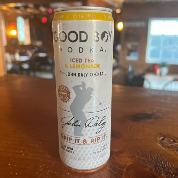 A can of Good Boy Vodka Iced Tea & Lemonade cocktail on a wooden bar at Riley's Place.