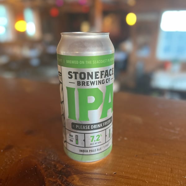 A can of Stoneface Brewing Co. IPA beer on a wooden table at Riley's Place.